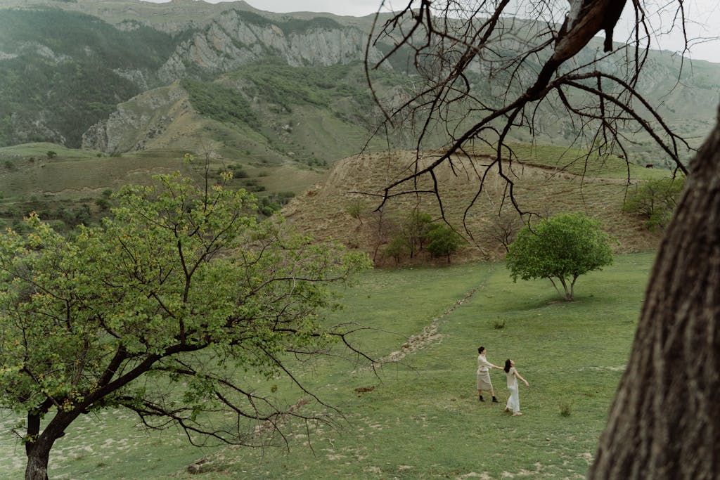 Women Walking on Grassland